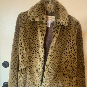 Faux leopard jacket. Narrows at waist. Never worn. Sized a bit small.
